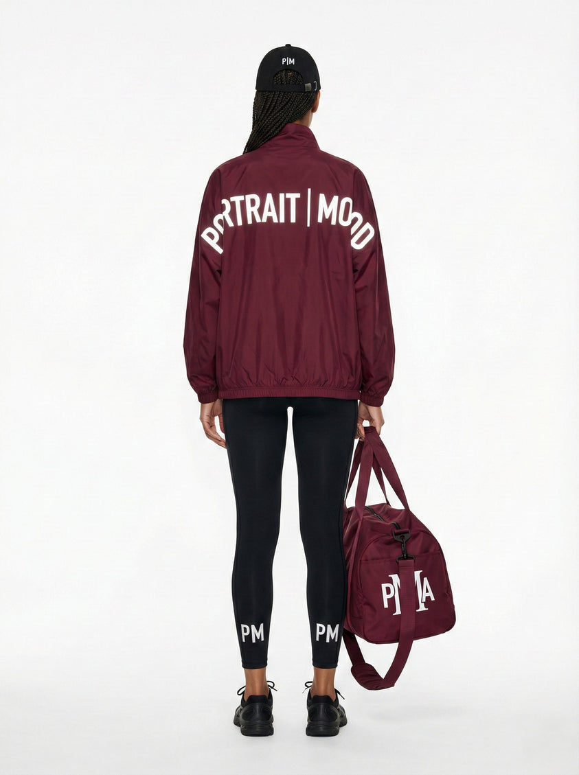 THE PMA ESSENTIAL BURGUNDY DUFFEL BAG