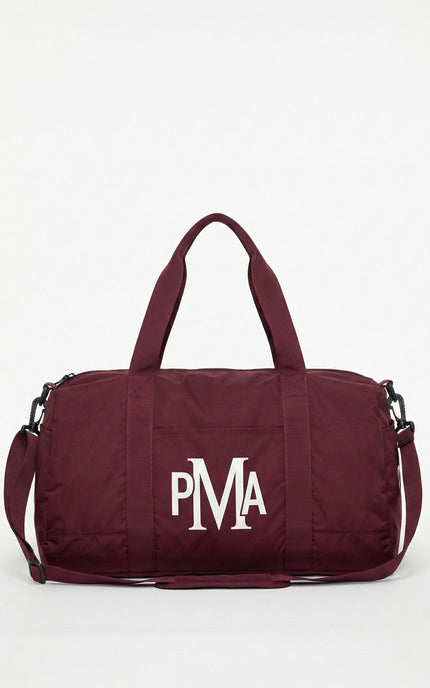THE PMA ESSENTIAL BURGUNDY DUFFEL BAG