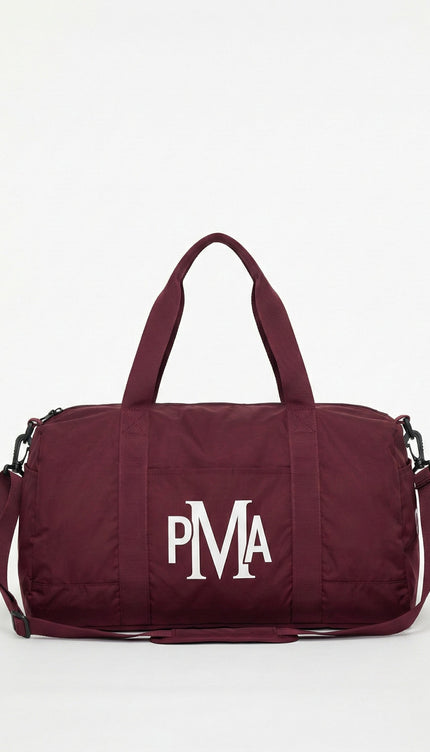 THE PMA ESSENTIAL BURGUNDY DUFFEL BAG