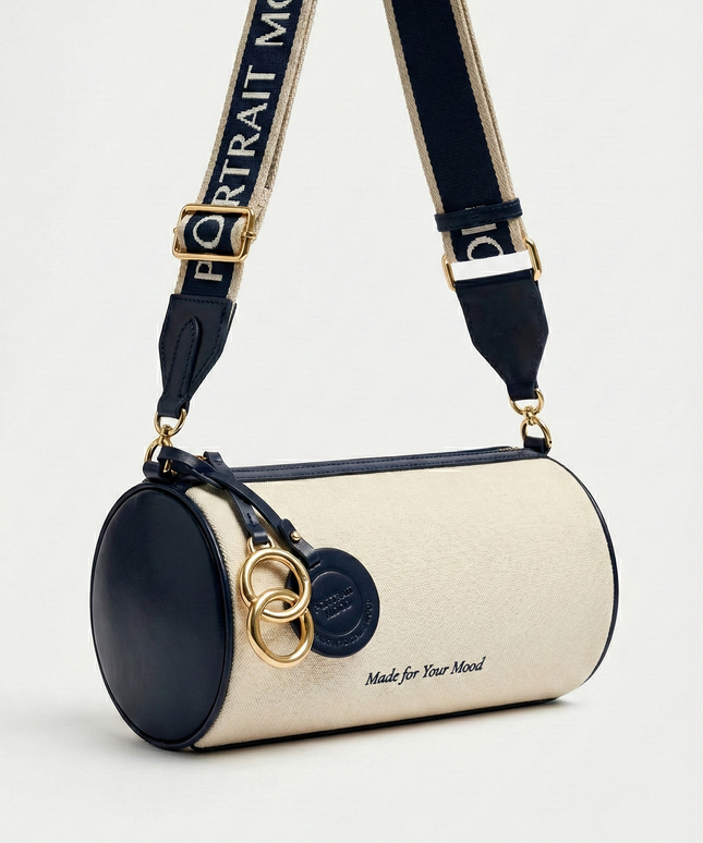 The P|M Cylinder Script Barrel Bag - Navy & Cream Edition