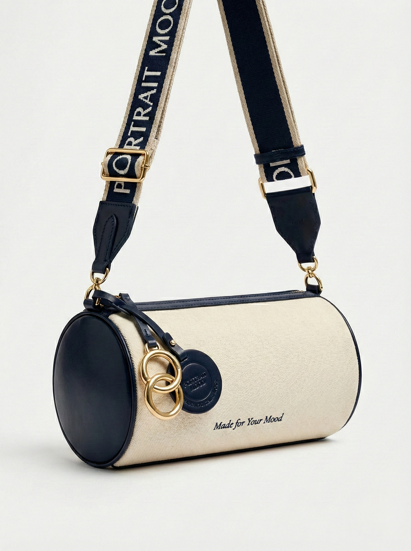 The P|M Cylinder Script Barrel Bag - Navy & Cream Edition