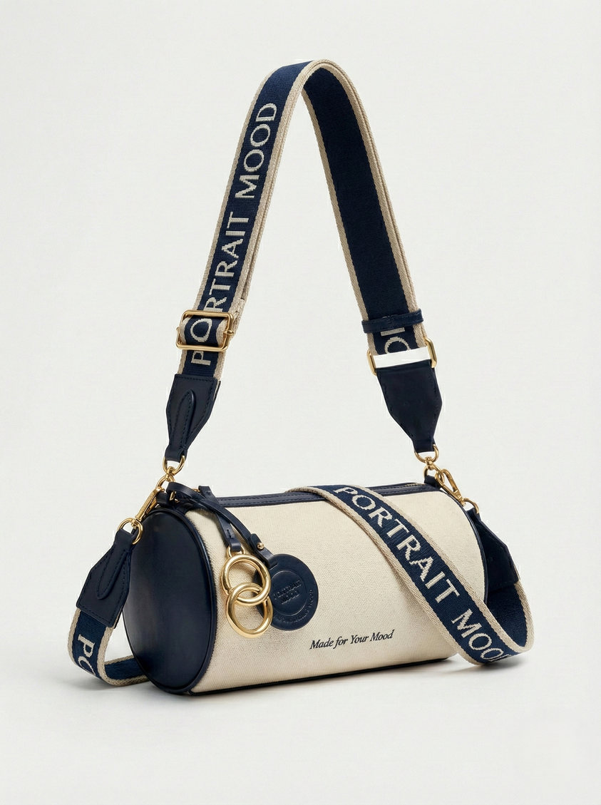 The P|M Cylinder Script Barrel Bag - Navy & Cream Edition