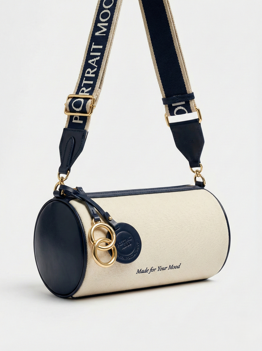 The P|M Cylinder Script Barrel Bag - Navy & Cream Edition