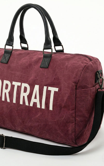 THE PORTRAIT VOYAGER DUFFEL – Burgundy Edition