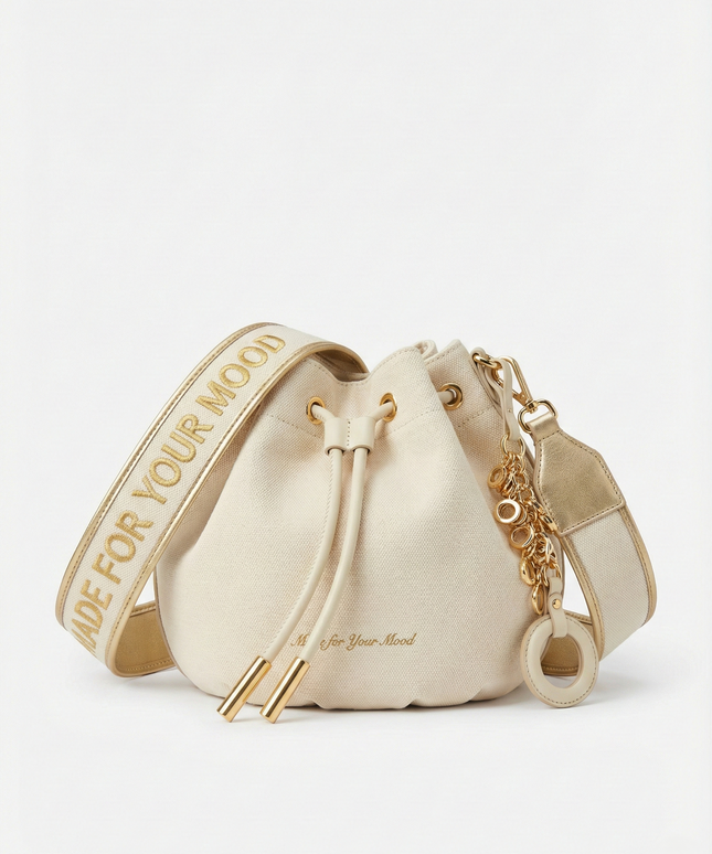 The P|M Aura Script Bucket Bag - White & Gold Edition