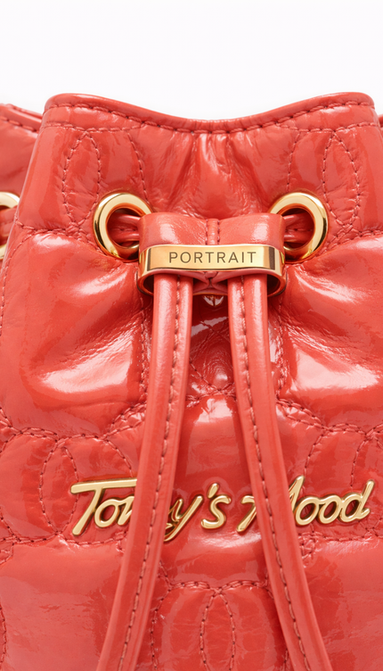 Gemini said The P|M Aura Quilted Bucket - Coral Patent Today's Mood Edition