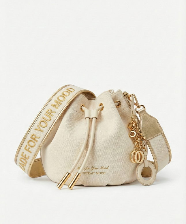 The P|M Aura Script Bucket Bag - White & Gold Edition
